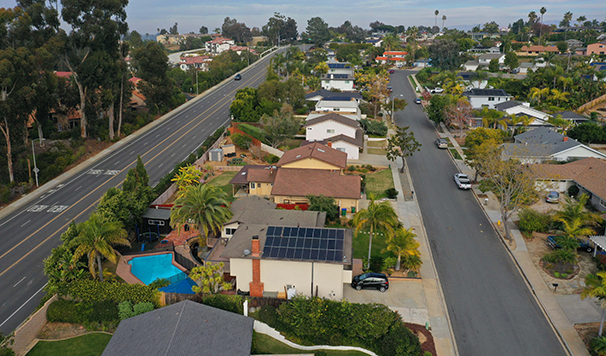 Aerial view of homes with solar panels